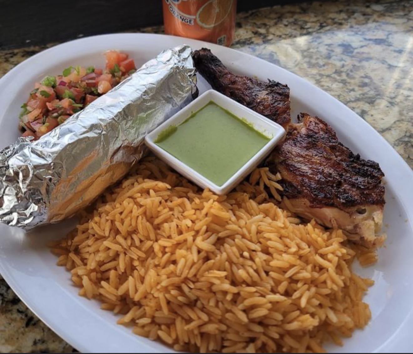 Grilled chicken plate with rice and salsa